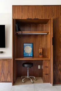 a room with a fireplace and cabinets