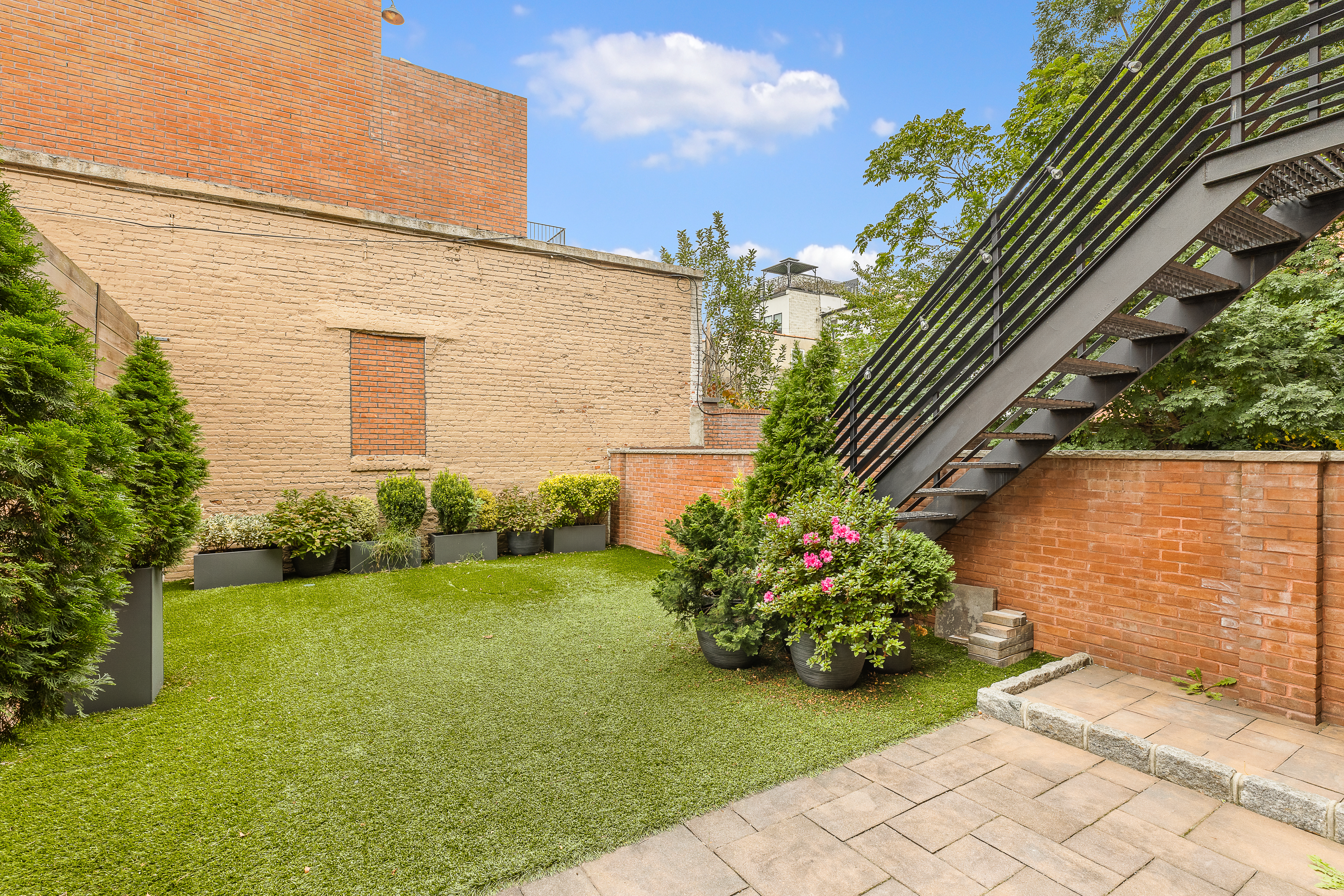 330 Bond Street Brooklyn, NY 11231 - Photo 14 of 18 a view of a garden with potted plants