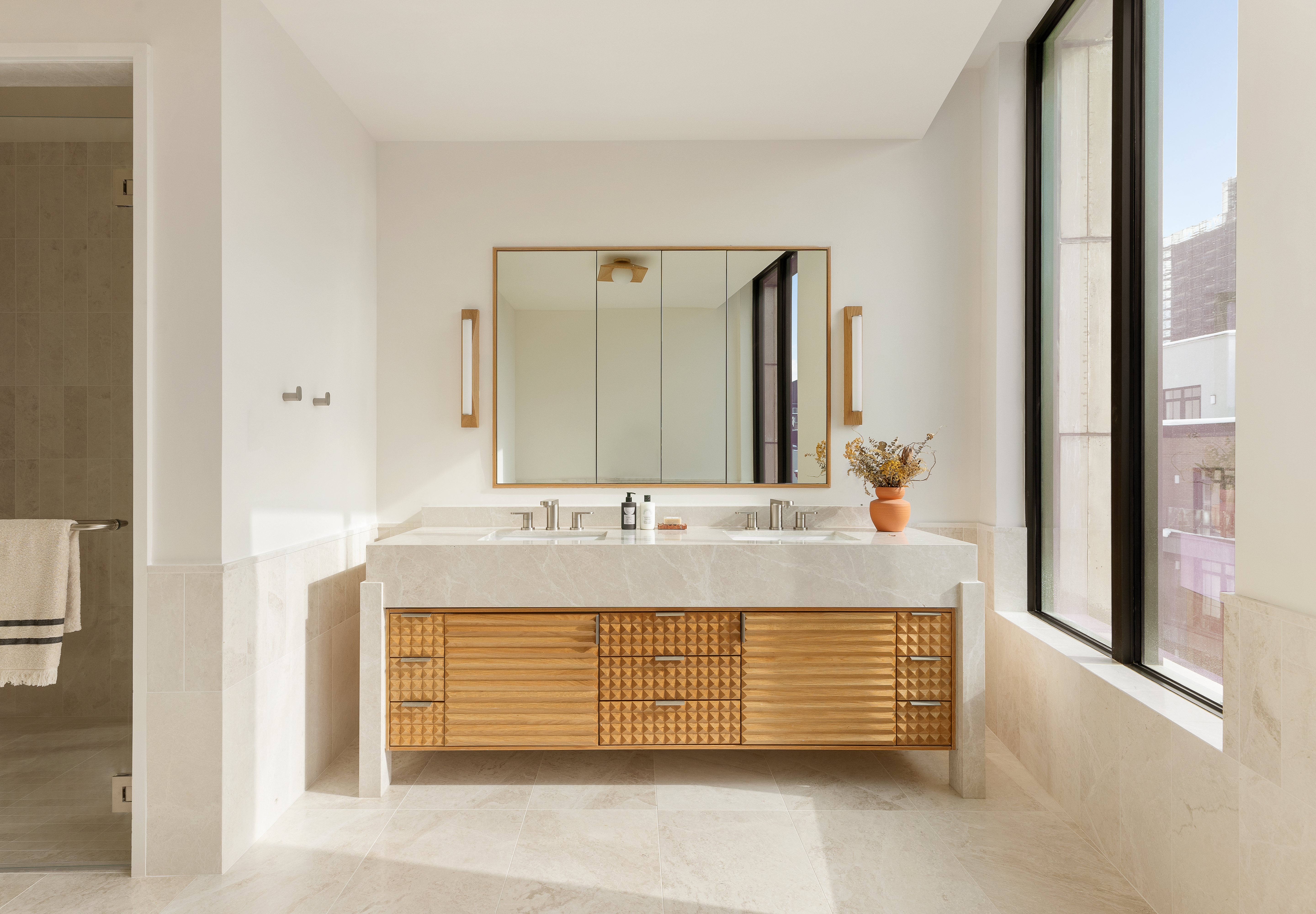 323 Bergen Street, Unit PH706E Brooklyn, NY 11217 - Photo 4 of 31 a bathroom with a granite countertop sink and a mirror