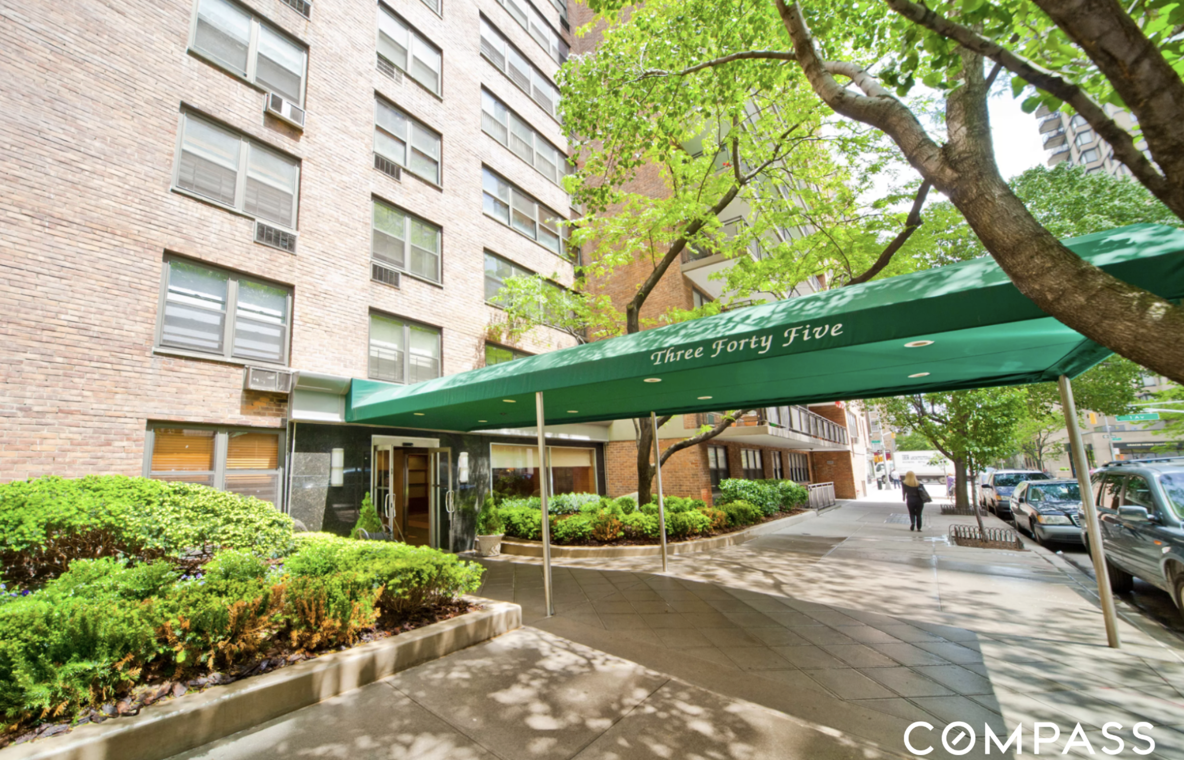 345 East 81st Street, Unit 19A Manhattan, NY 10028 - Photo 14 of 22 a view of a patio with a table and chairs under an umbrella