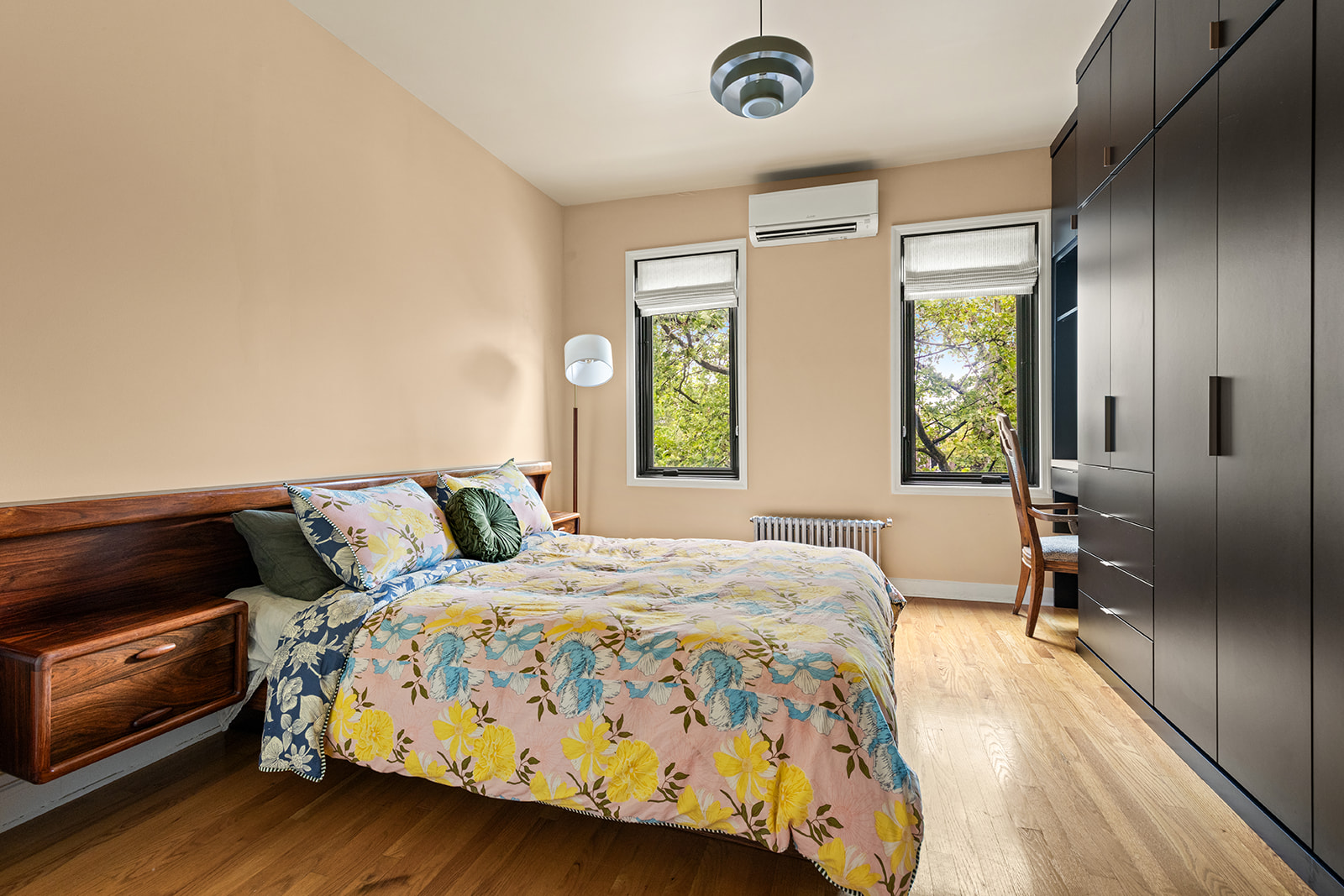 570 19th Street Brooklyn, NY 11218 - Photo 6 of 13 a bedroom with a bed and a chandelier