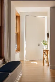 a view of a room that has a bed and a potted plant