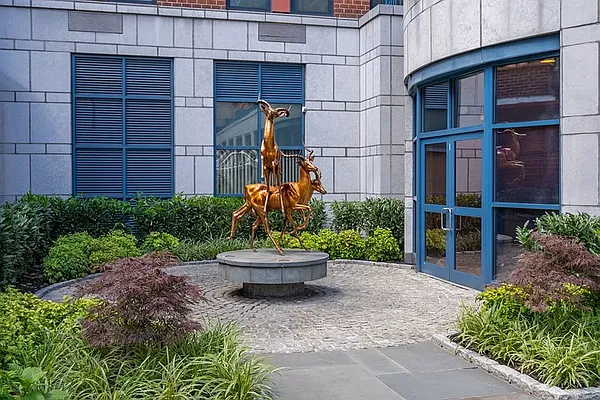 404 East 76th Street, Unit 30C Manhattan, NY 10021 - Photo 21 of 24 a view of a house with a garden