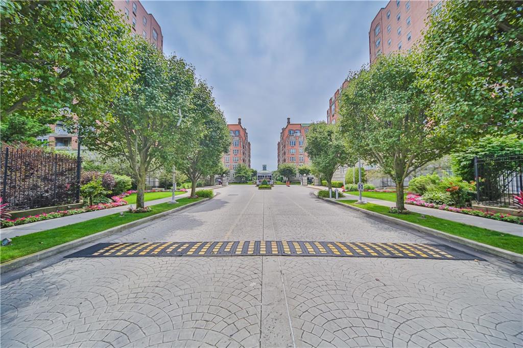 135 Oceana Drive East, Unit 2C Brooklyn, NY 11235 - Photo 17 of 29 a white house with a yard and a trees