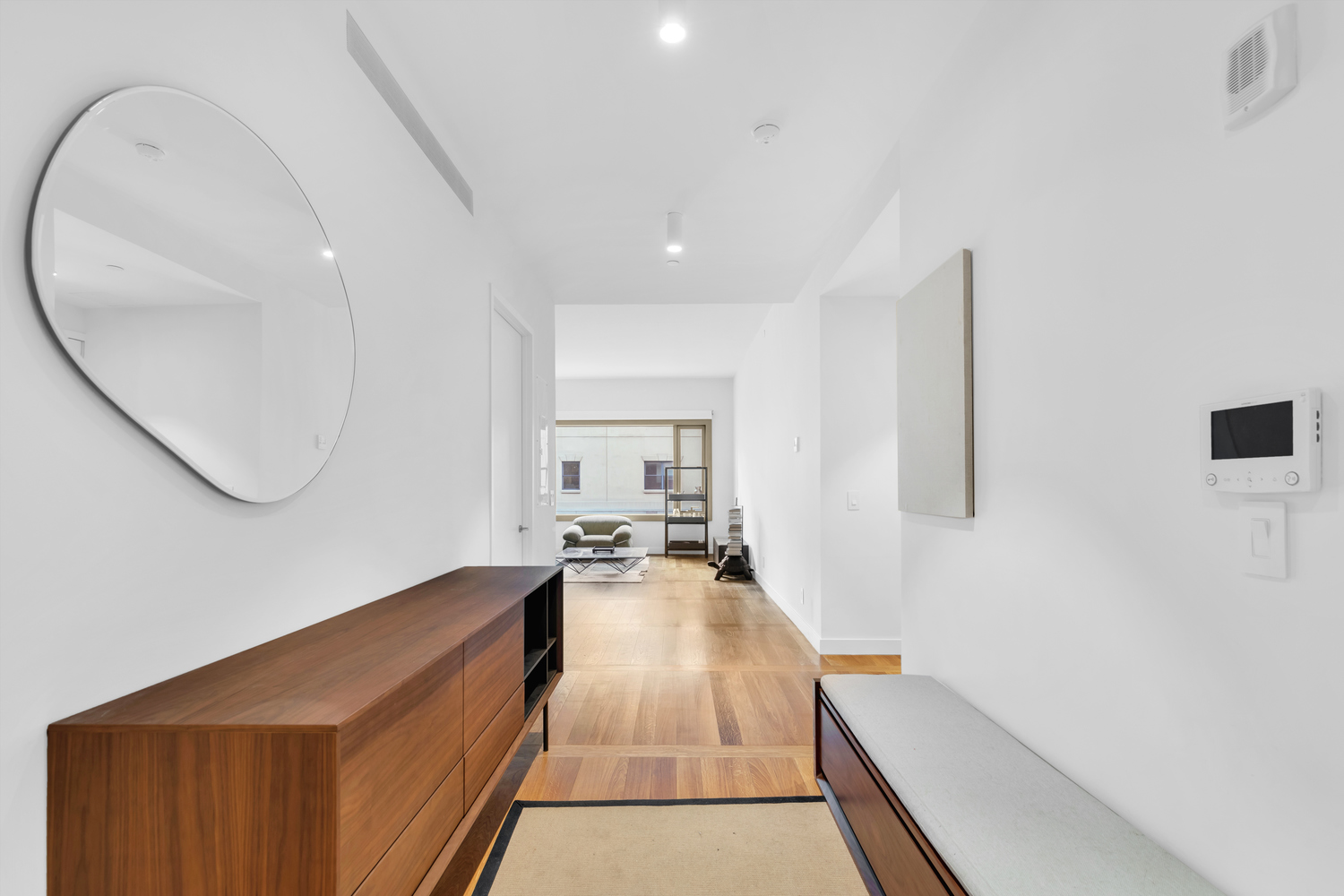 30 Warren Street, Unit 2C Manhattan, NY 10007 - Photo 5 of 18 a hallway with a white cabinets