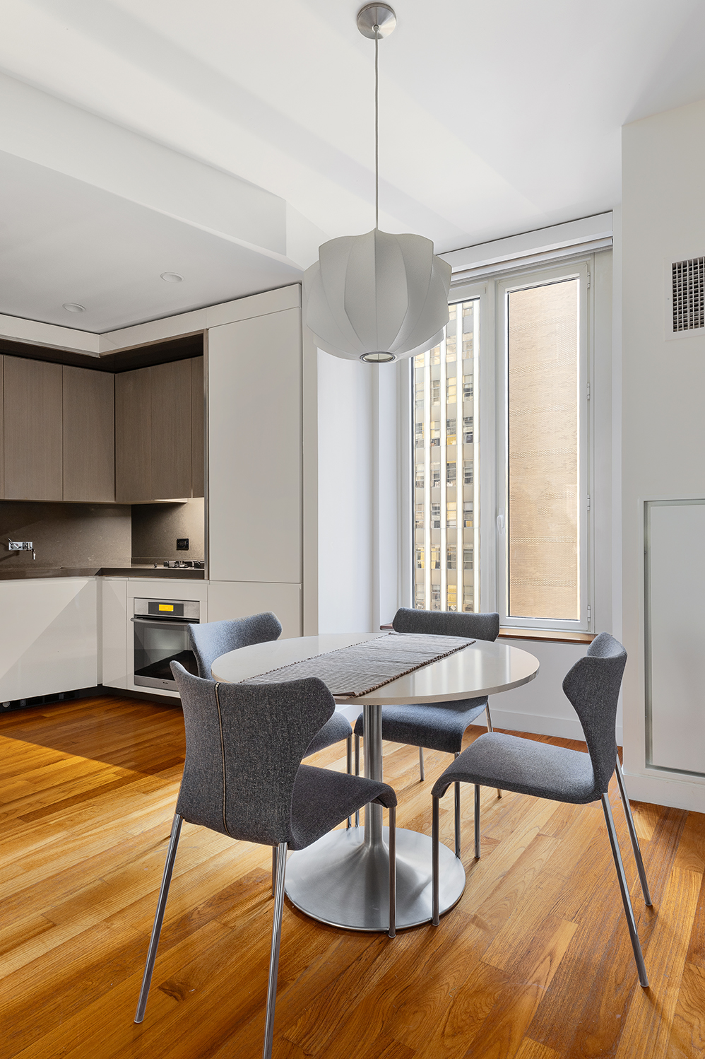15 William Street, Unit 22H Manhattan, NY 10005 - Photo 3 of 20 a view of a dining room with furniture window and outside view