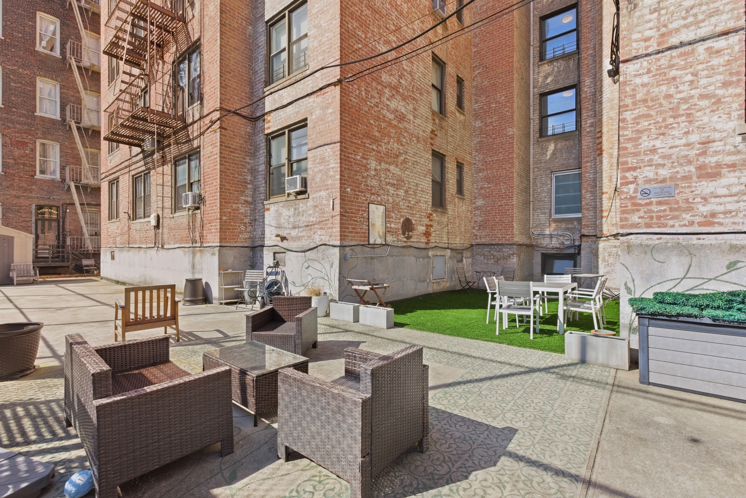 160 West 85th Street, Unit 6K Manhattan, NY 10024 - Photo 8 of 10 a view of a patio with couches and a fire pit and wooden fence