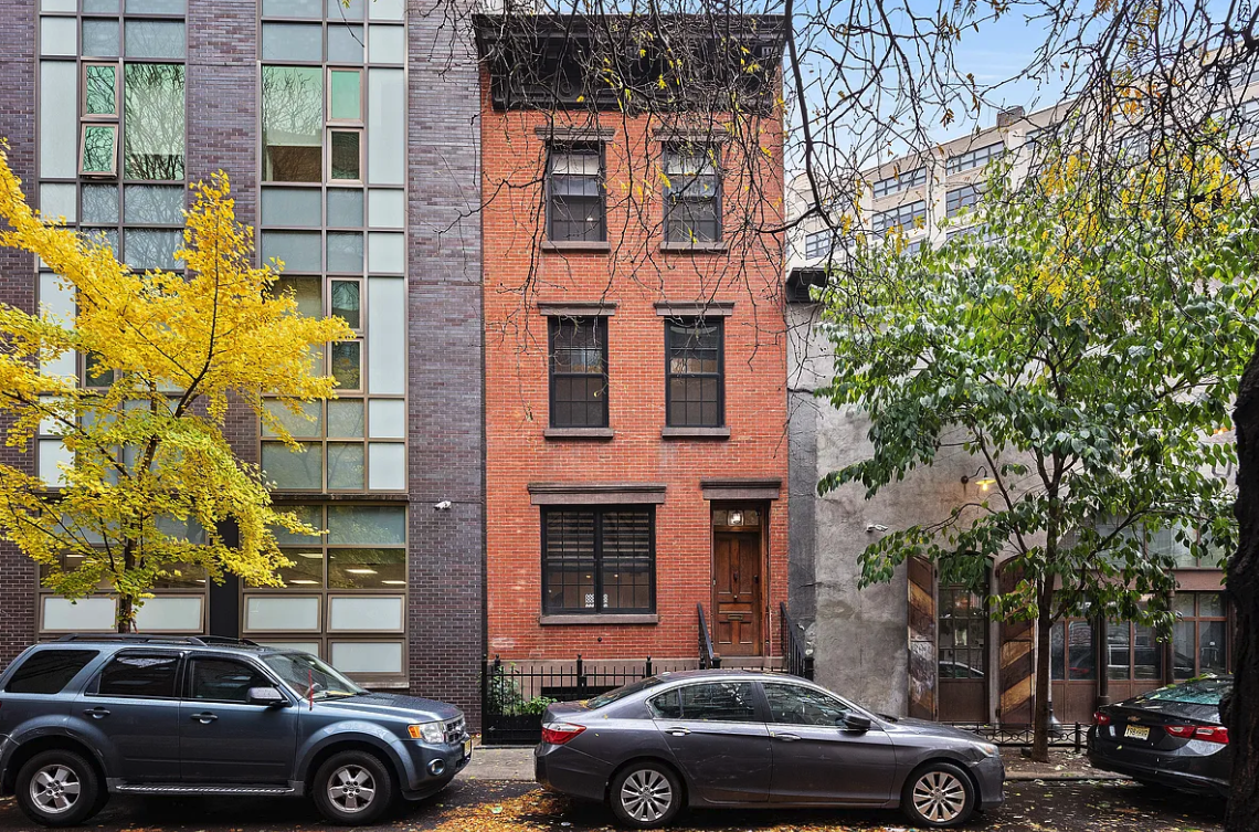 a view of a car parked in front of a building