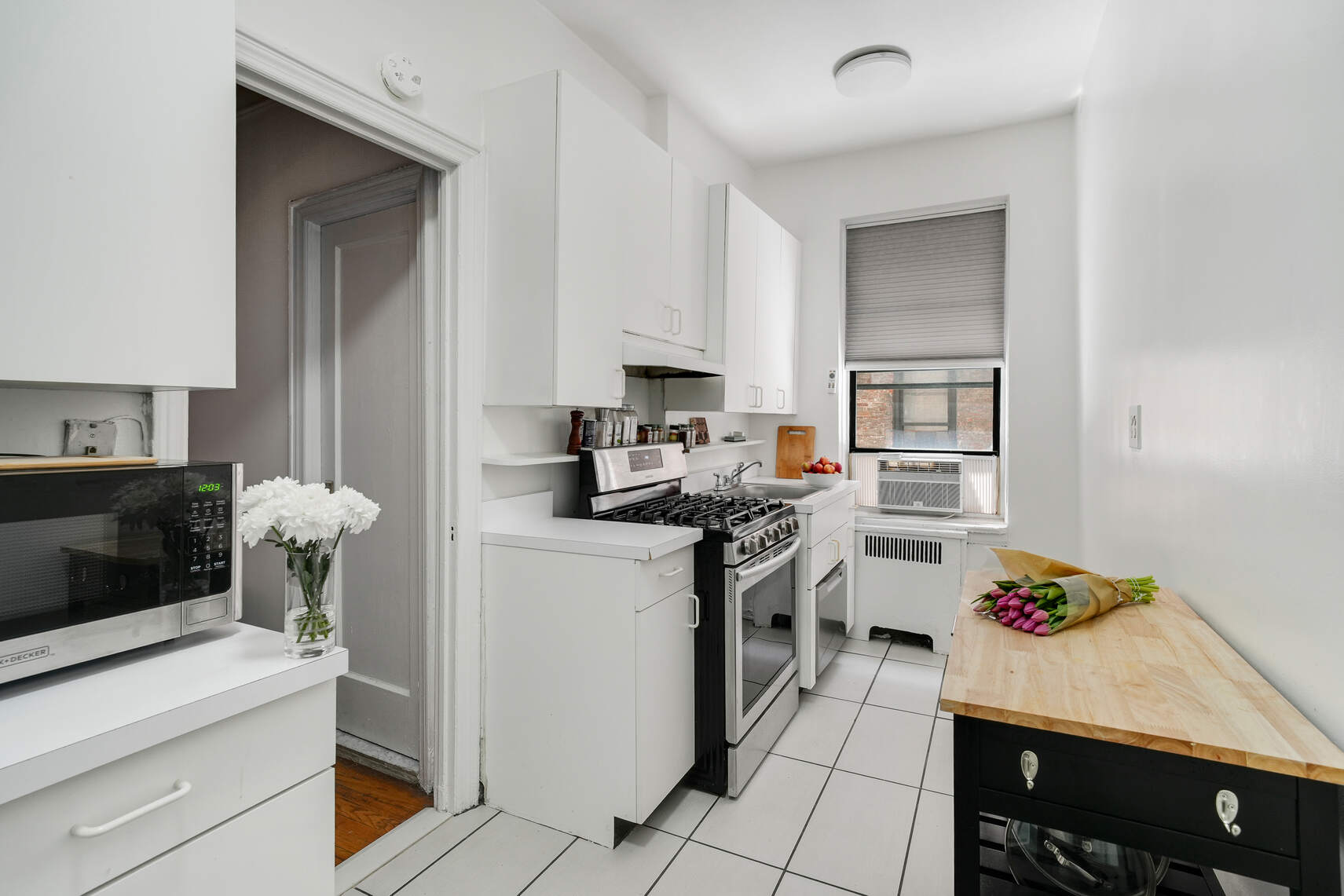 668 Riverside Drive, Unit 3G Manhattan, NY 10031 - Photo 3 of 6 a kitchen with a sink cabinets and appliances