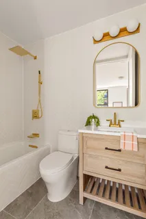 a bathroom with a toilet a sink and a bathtub