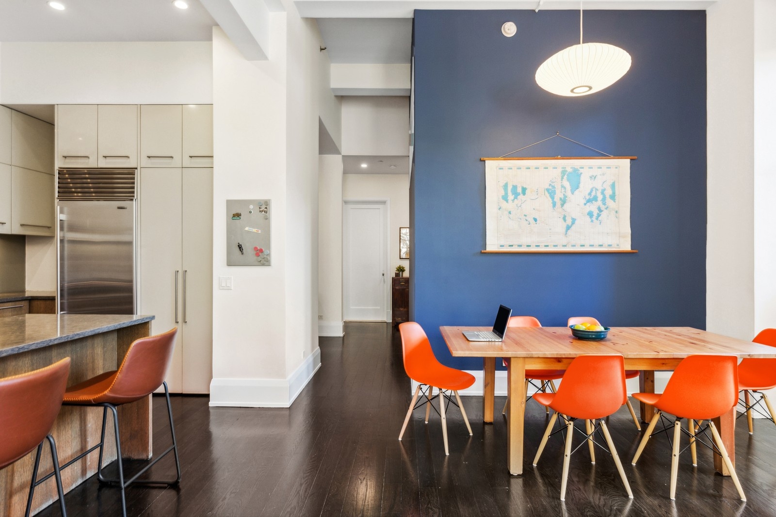 263 9th Avenue, Unit 3D Manhattan, NY 10001 - Photo 4 of 15 a dining room with furniture and wooden floor