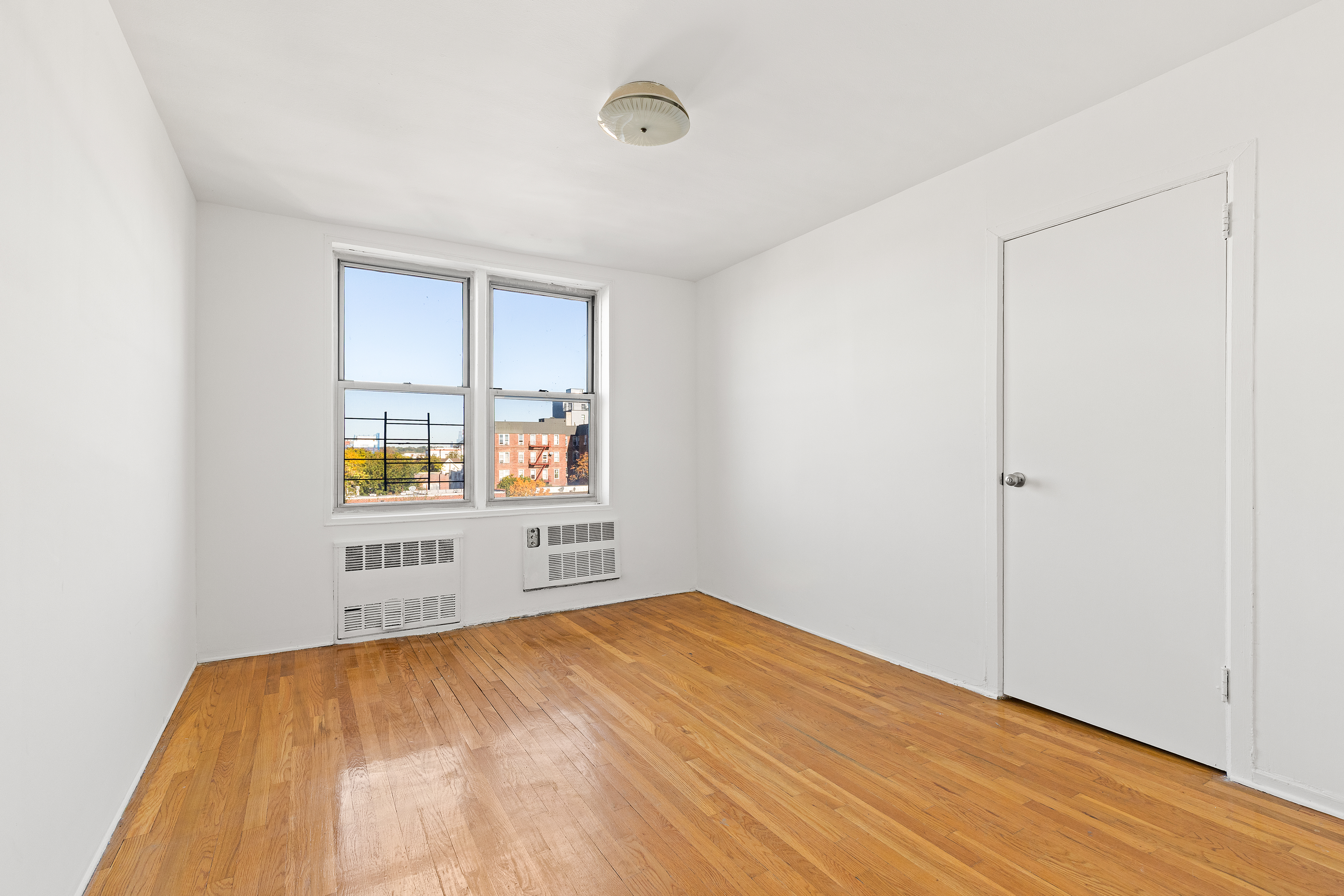 770 Ocean Parkway, Unit 6F Brooklyn, NY 11230 - Photo 8 of 17 an empty room with a window