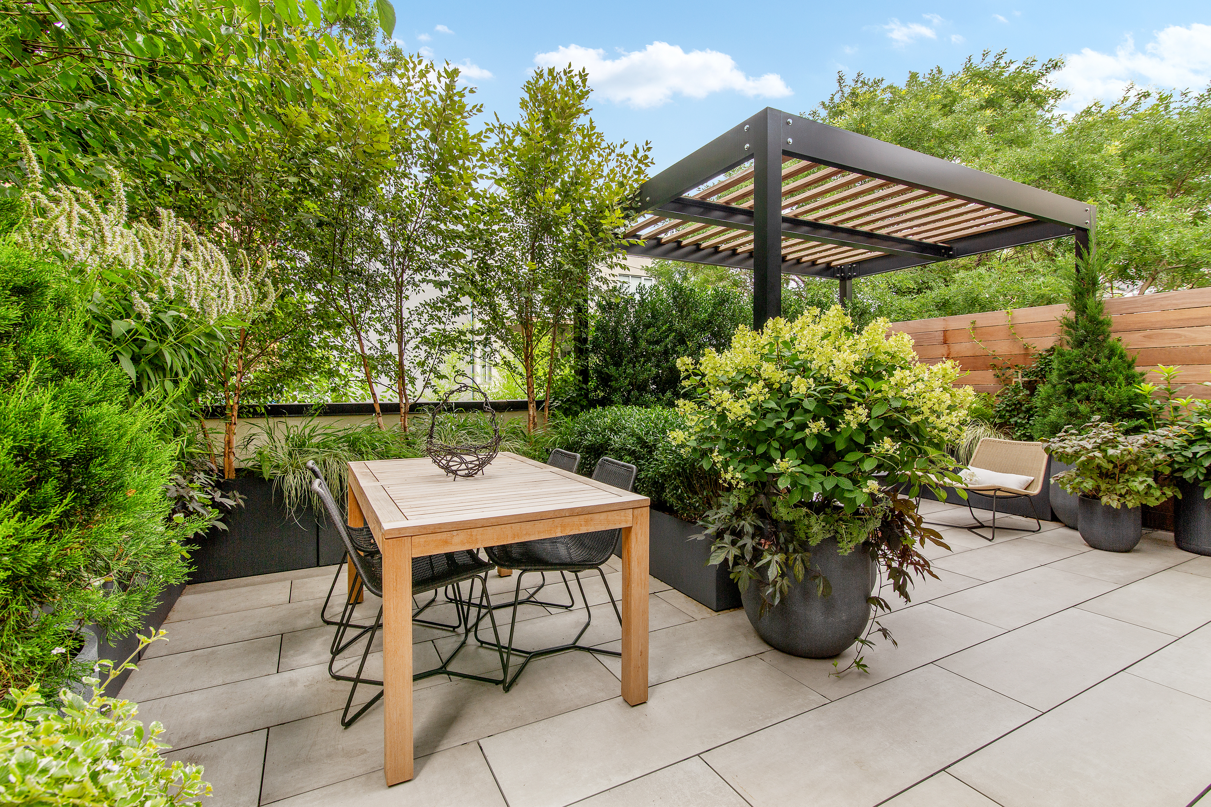 735 Dean Street, Unit 2B Brooklyn, NY 11238 - Photo 9 of 11 a backyard of a house with table and chairs