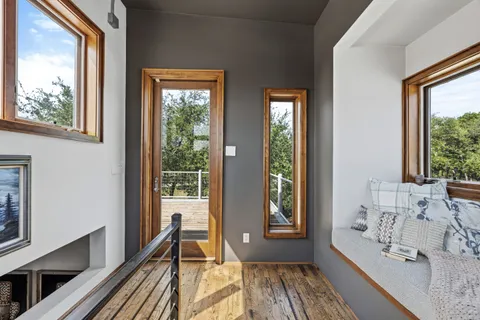a view of a house with backyard sitting area and garden
