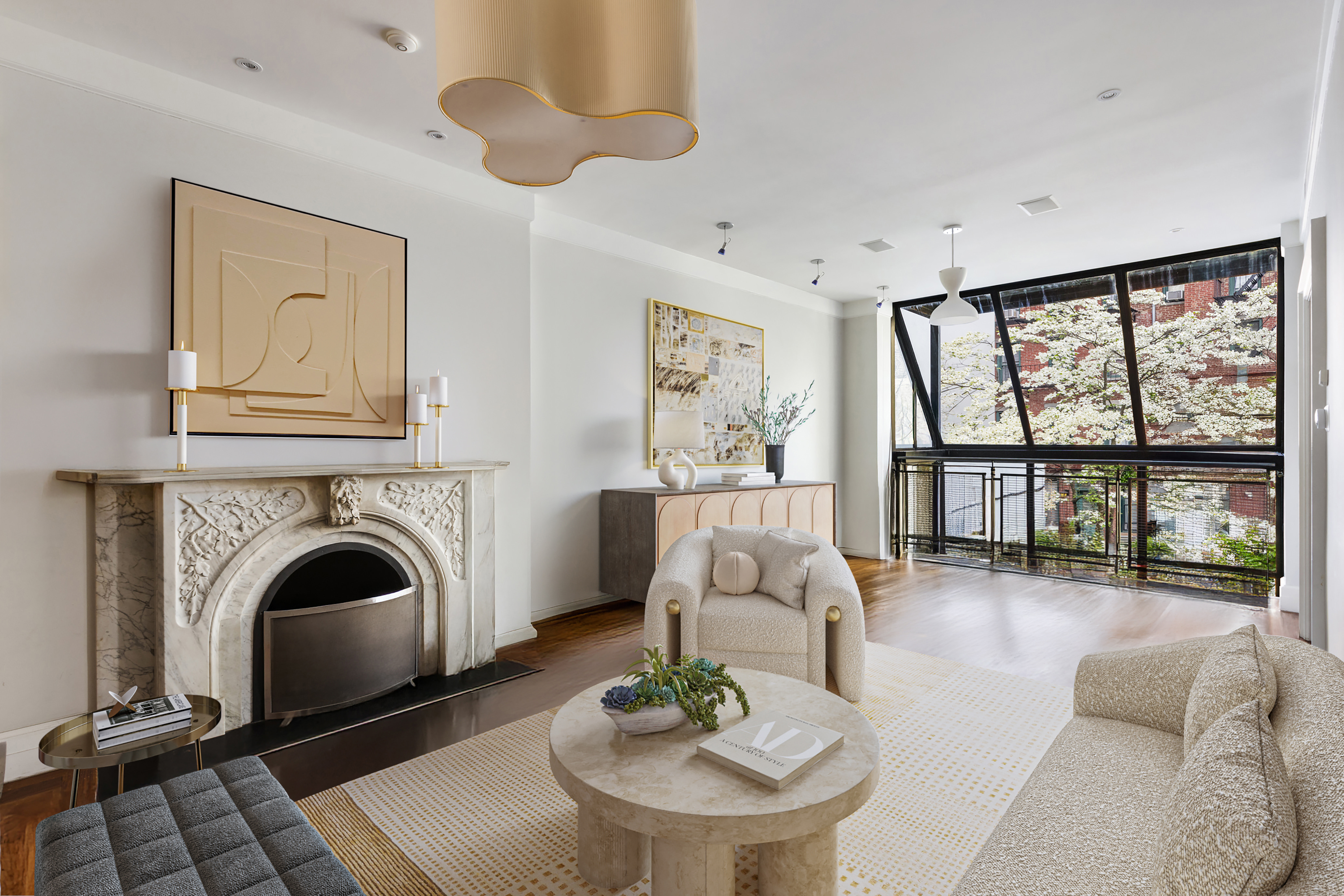 83 Jane Street, Unit TH1 Manhattan, NY 10014 - Photo 9 of 29 a living room with furniture fireplace and a large window