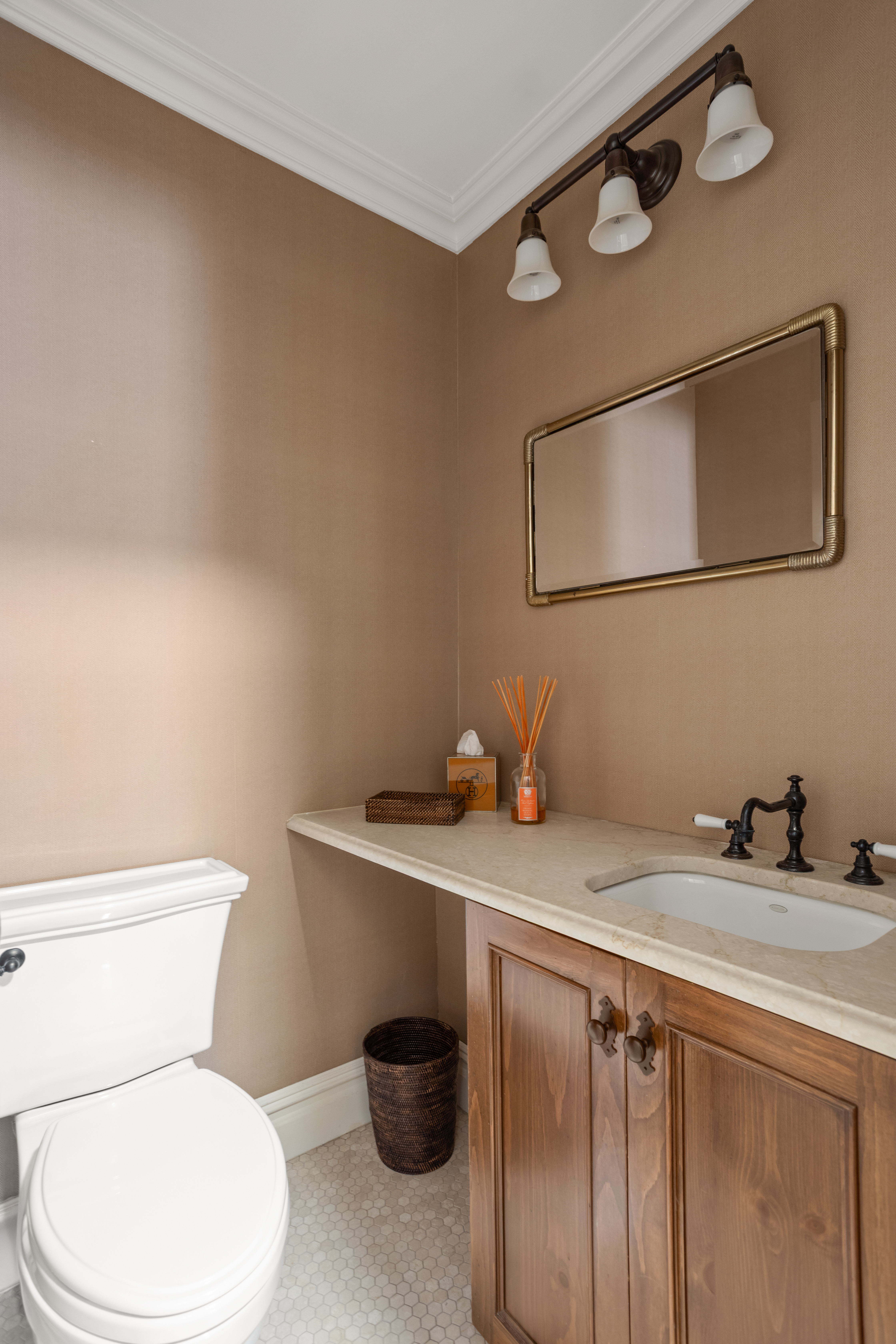 60 East End Avenue, Unit 12C Manhattan, NY 10028 - Photo 20 of 27 a white toilet sitting next to a bathroom sink