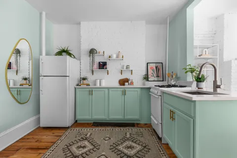 a utility room with sink dryer and washer