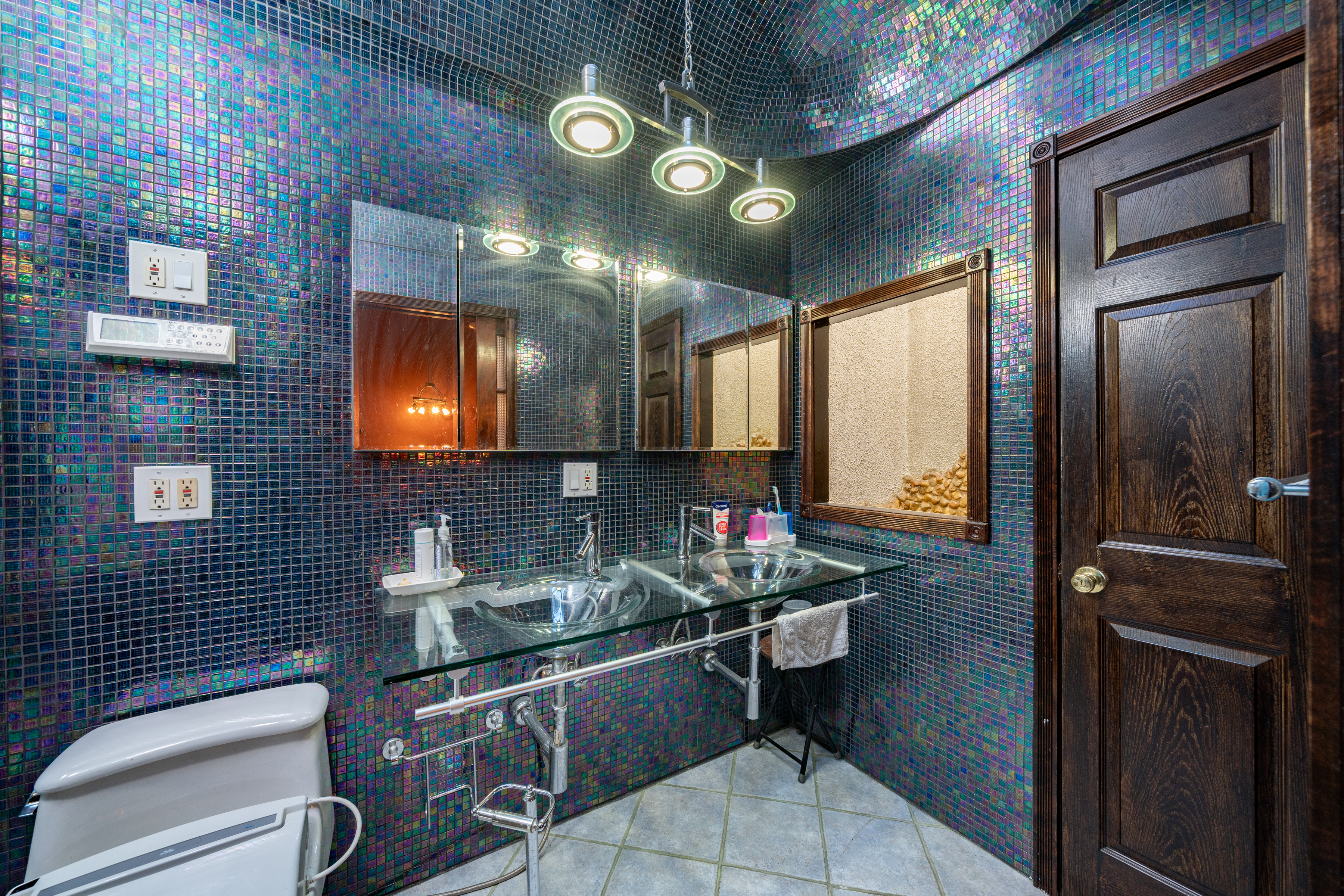 415 84th Street Brooklyn, NY 11209 - Photo 9 of 17 a bathroom with a sink and a mirror