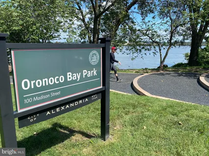 a view of a sign board with a park