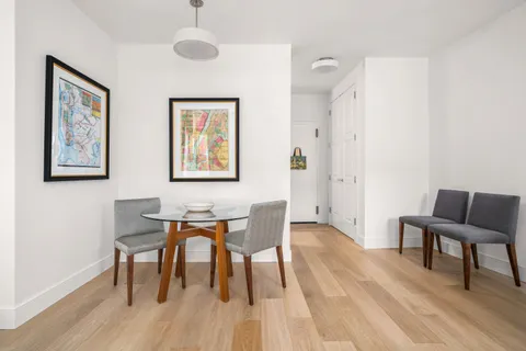a view of a livingroom with furniture and wooden floor
