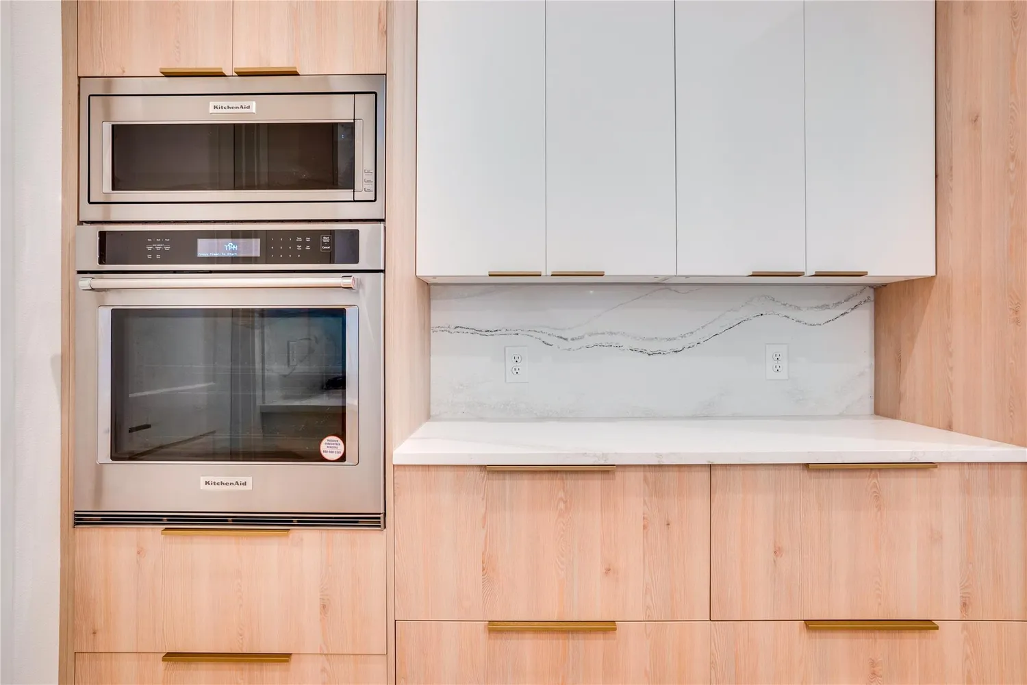 a kitchen with granite countertop white cabinets and oven