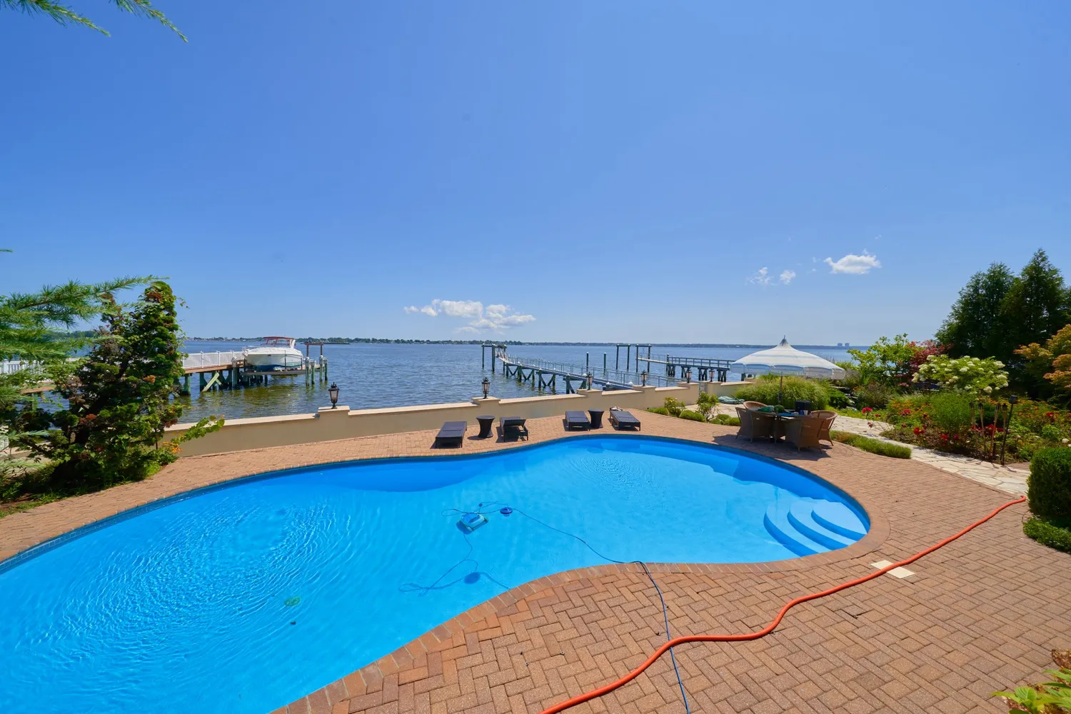 a view of a room with furniture and wooden floor