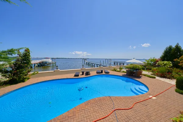 a view of a room with furniture and wooden floor