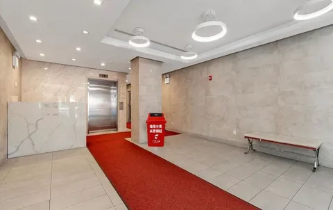 a bathroom with a tub and shower
