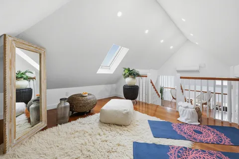 a big house with a big yard and large trees