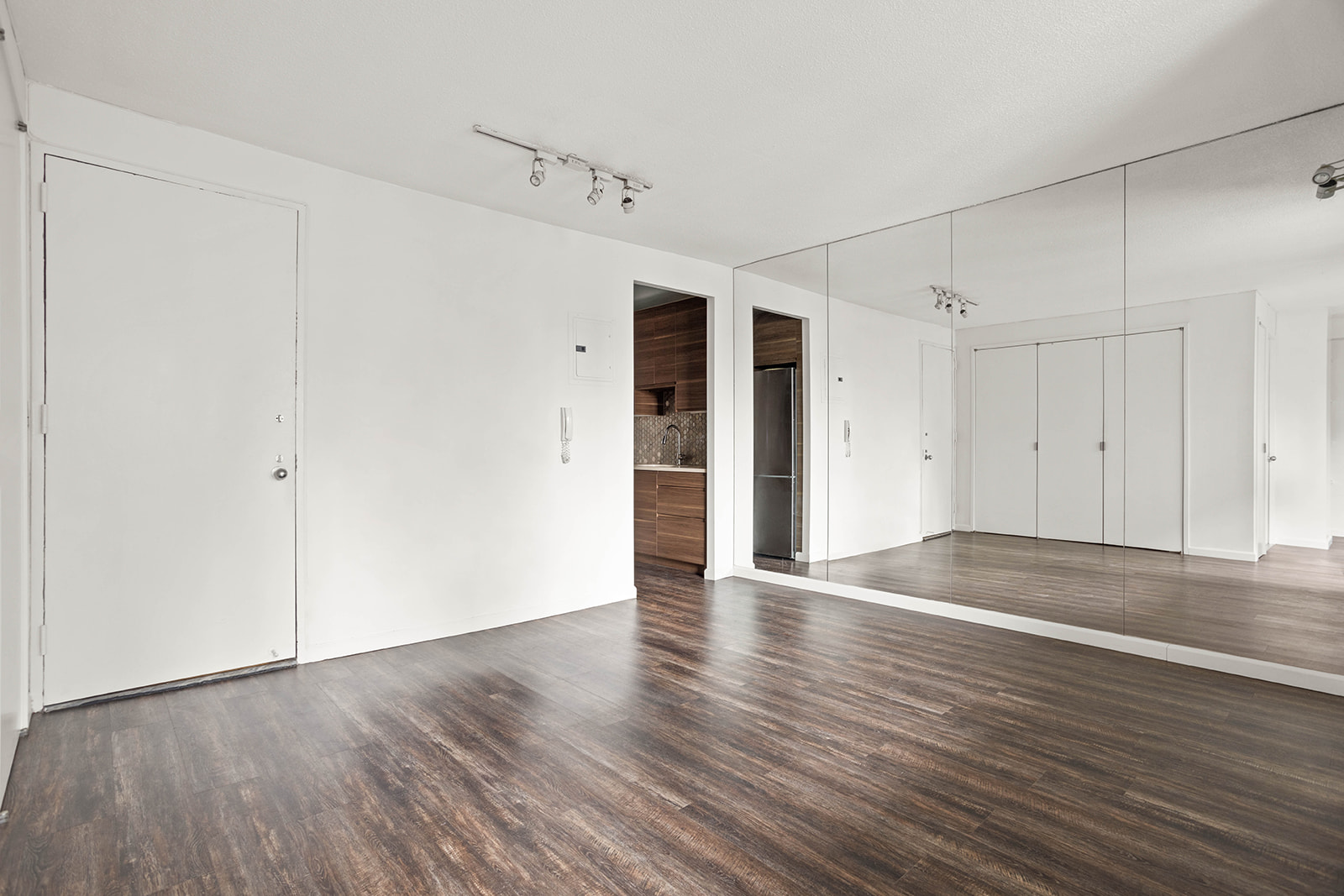233 East 86th Street, Unit 16A Manhattan, NY 10028 - Photo 3 of 7 an empty room with wooden floor
