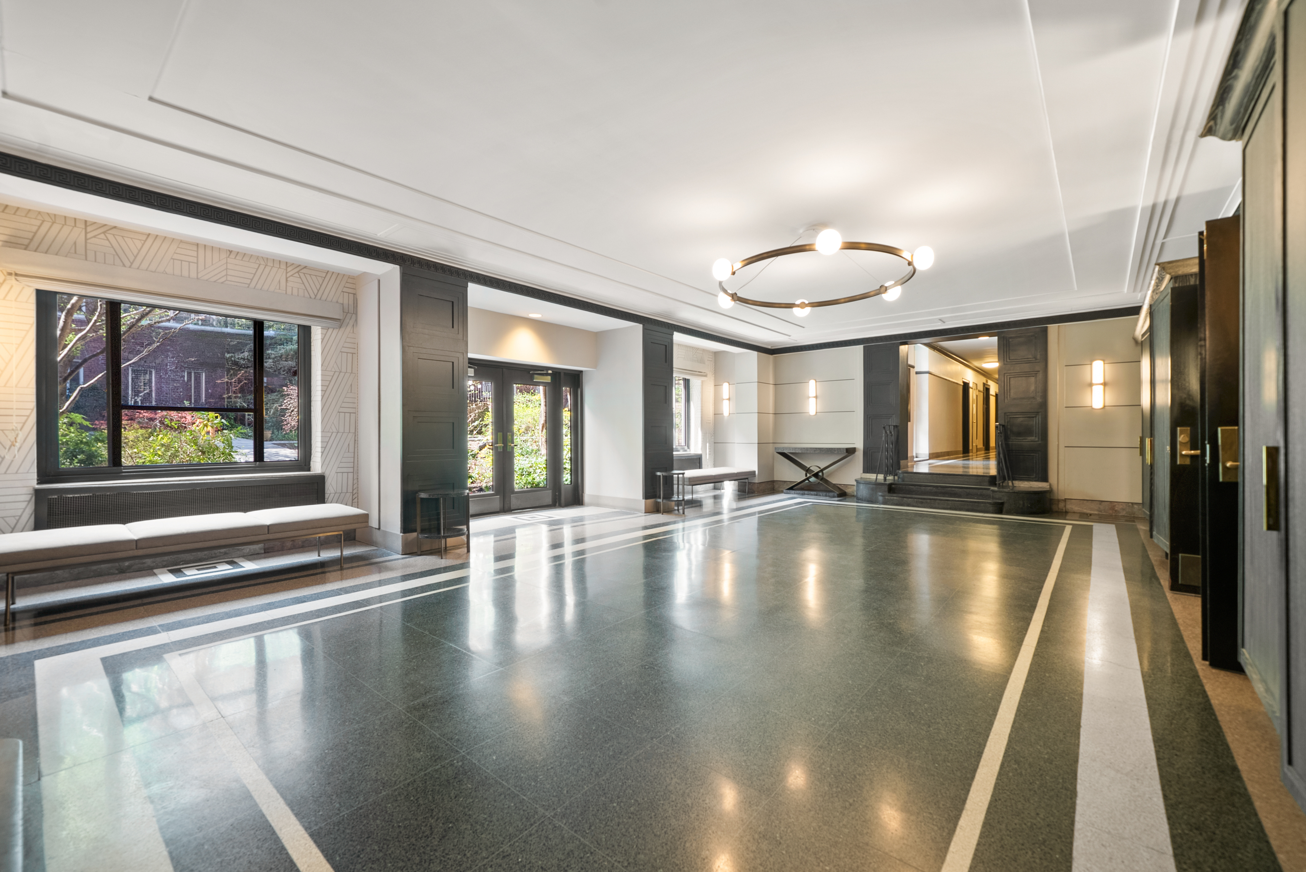530 East 90th Street, Unit 2M Manhattan, NY 10128 - Photo 9 of 12 a view of an entryway with a chandelier