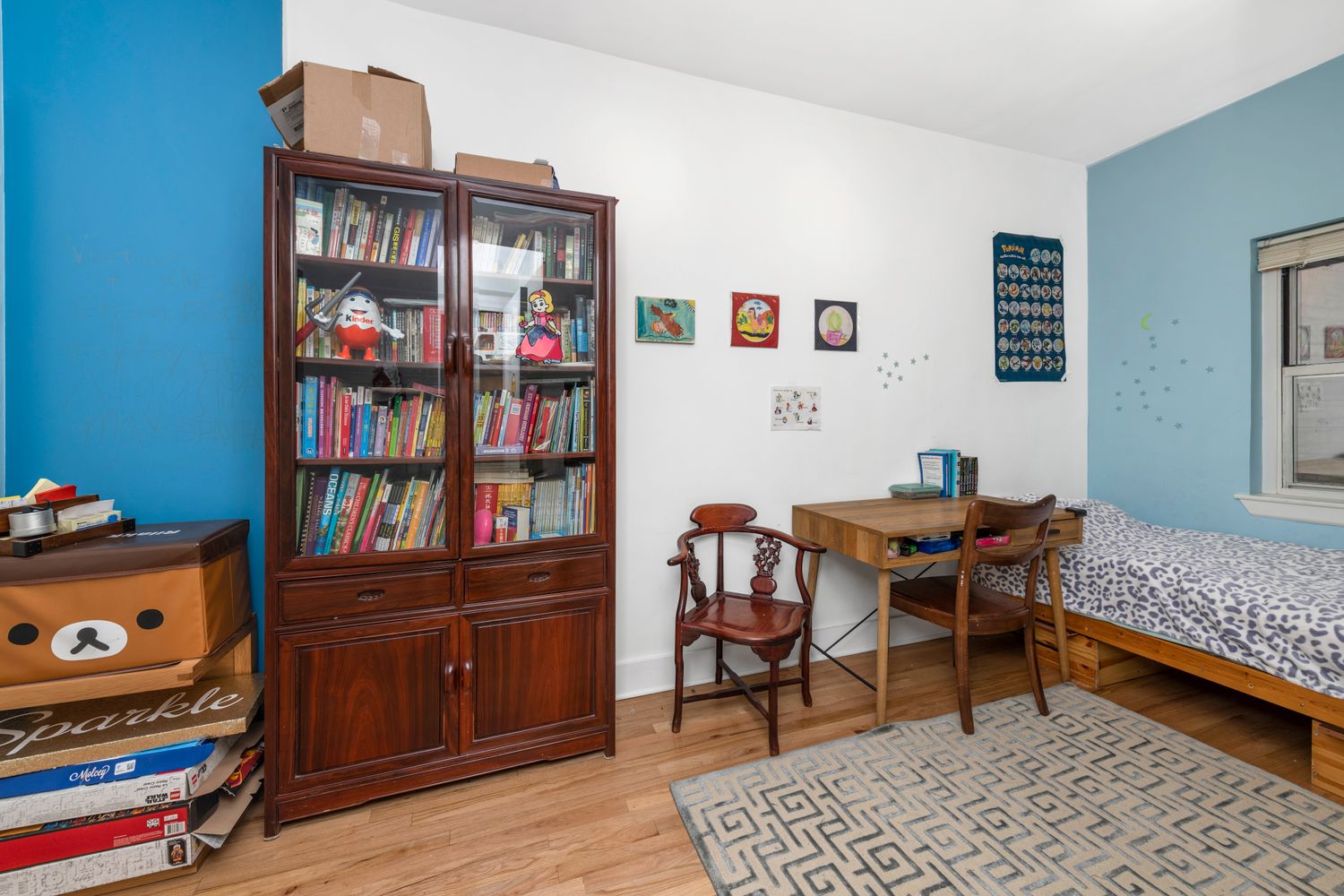 320 East 83rd Street, Unit 4DE Manhattan, NY 10028 - Photo 7 of 12 a bedroom with furniture and a book shelf