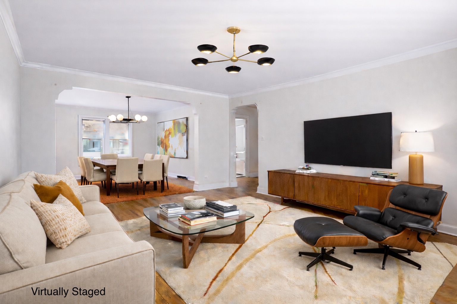 5444 Arlington Avenue, Unit G51 Bronx, NY 10471 - Photo 1 of 16 a living room with furniture and a flat screen tv
