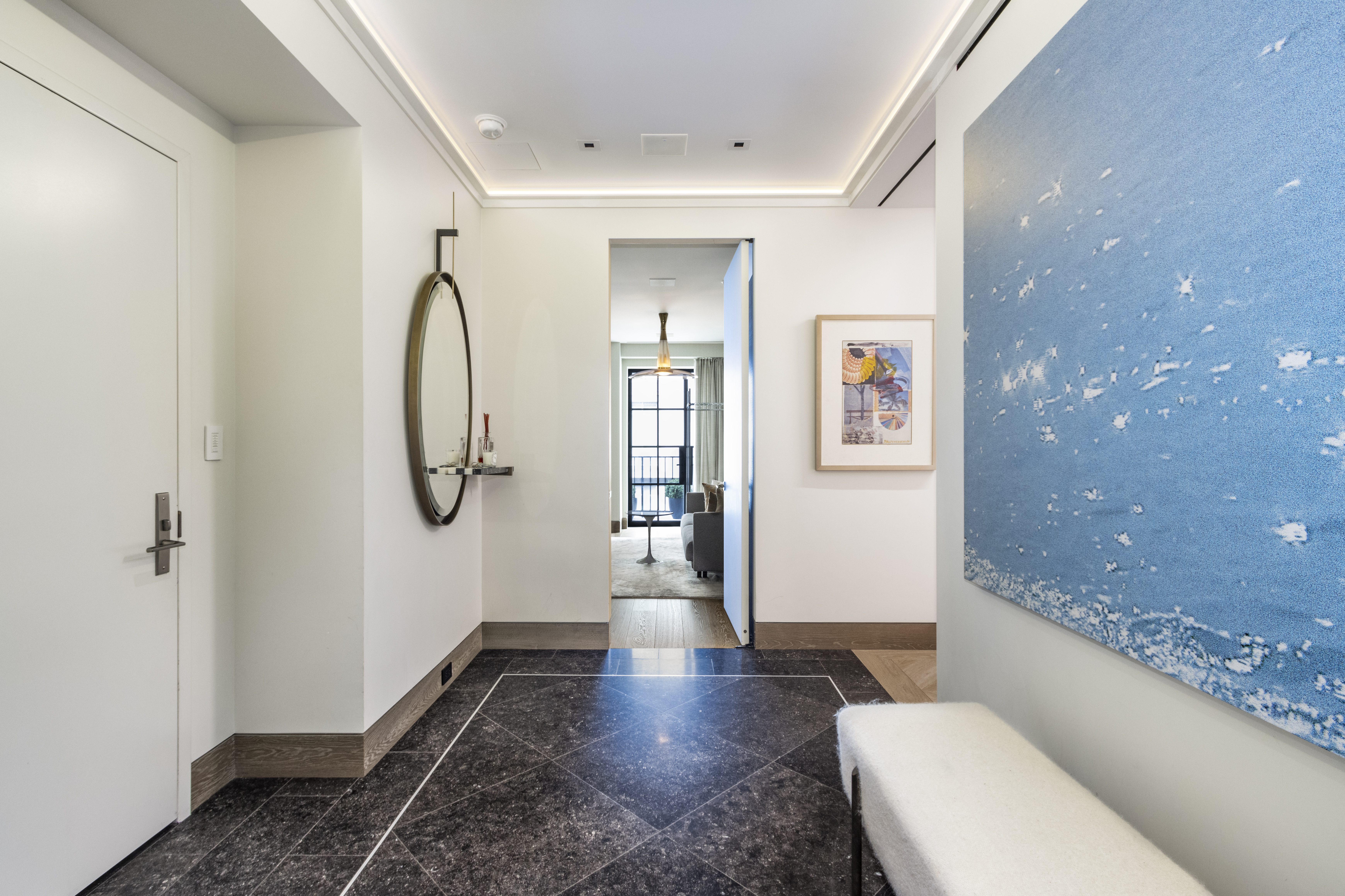 40 East 61st Street, Unit 18A Manhattan, NY 10065 - Photo 14 of 15 a bathroom with a granite countertop sink a toilet and shower