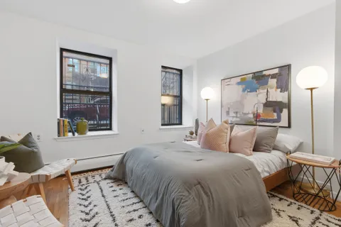 a bathroom with a sink toilet tub and shower