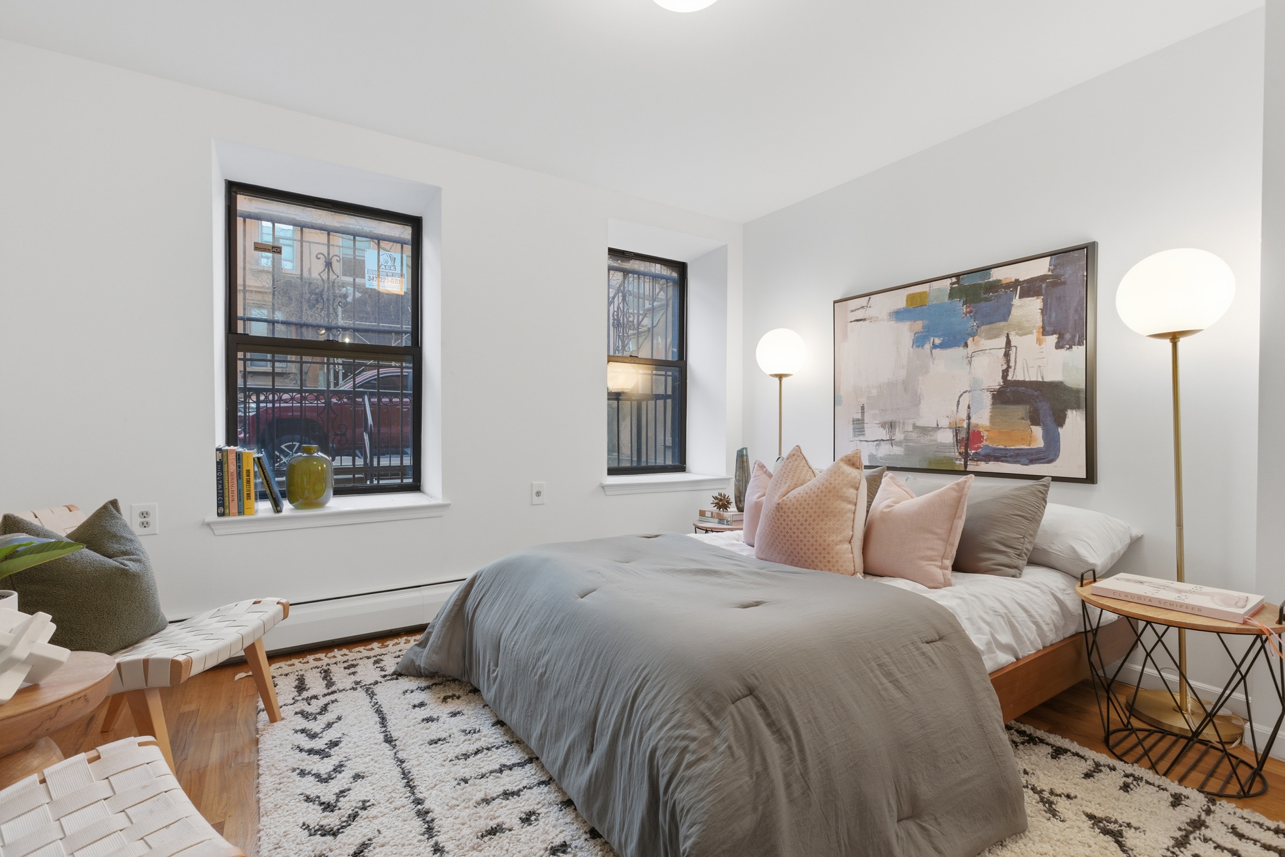 20 East 126th Street Manhattan, NY 10035 - Photo 8 of 19 a bedroom with a large bed and a window