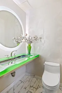 a bathroom with a toilet and a sink