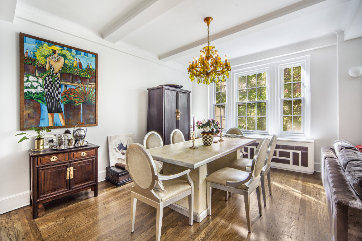 108 East 82nd Street, Unit 4D Manhattan, NY 10028 - Photo 2 of 10 a view of a dining room with furniture a livingroom and chandelier