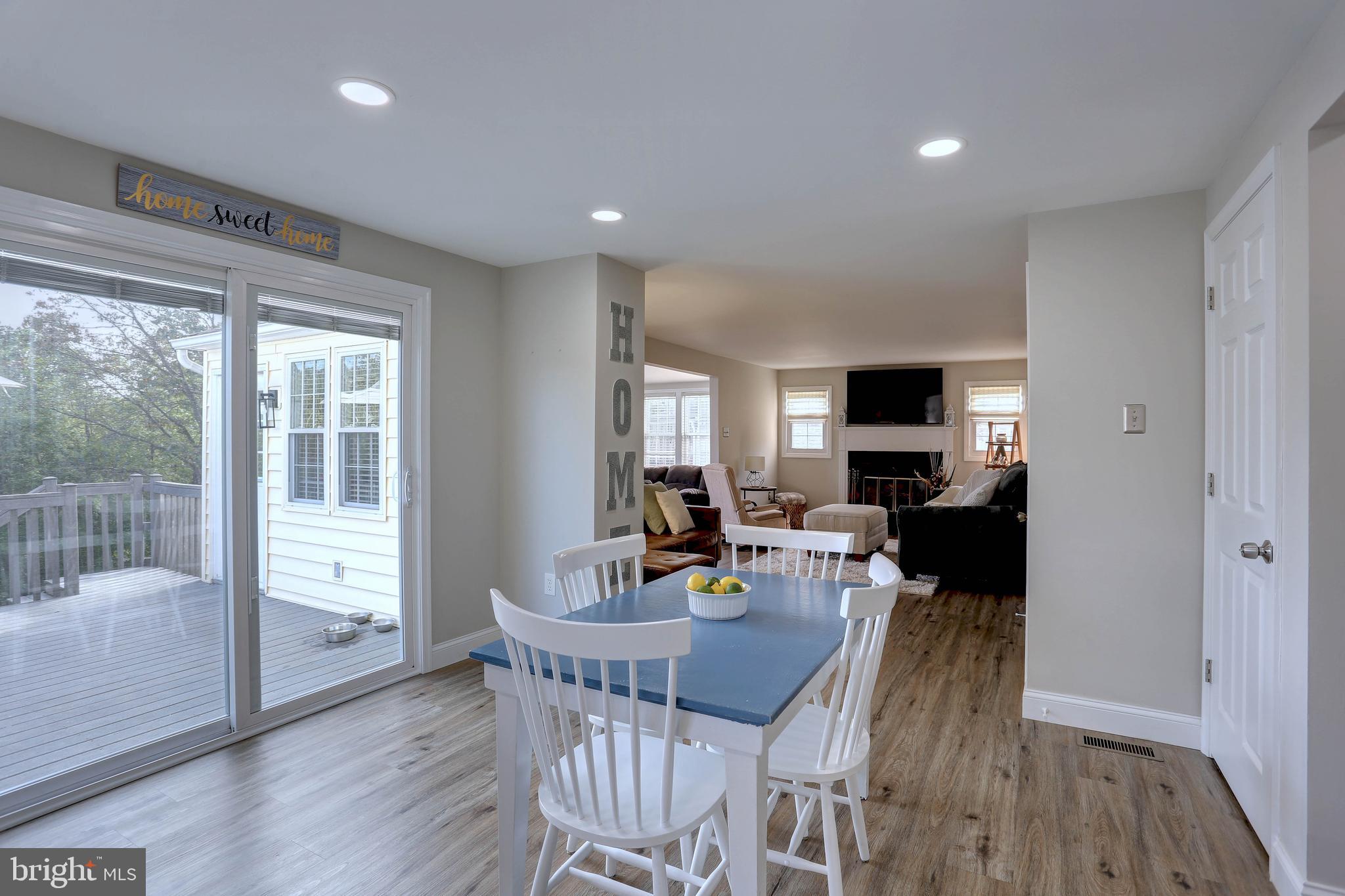 6257 Fairbourne Court Hanover, MD 21076 - Photo 13 of 47 a view of a dining room with furniture window and wooden floor