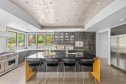 a kitchen with a table and chairs in it