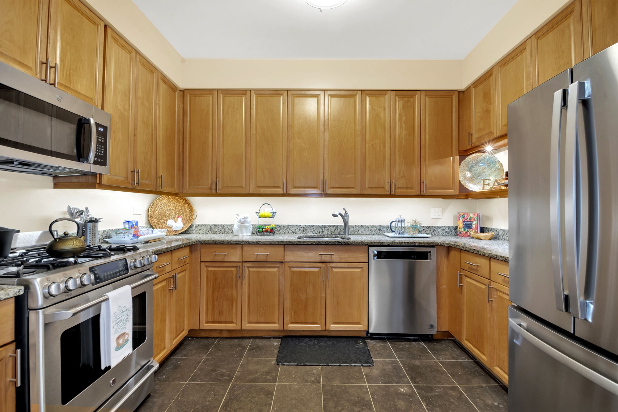 1 Mount Morris Park West, Unit 1A Manhattan, NY 10027 - Photo 10 of 12 a kitchen with stainless steel appliances a stove a sink and cabinets