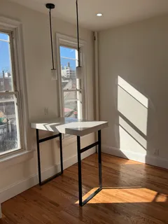 a view of workspace with furniture and window