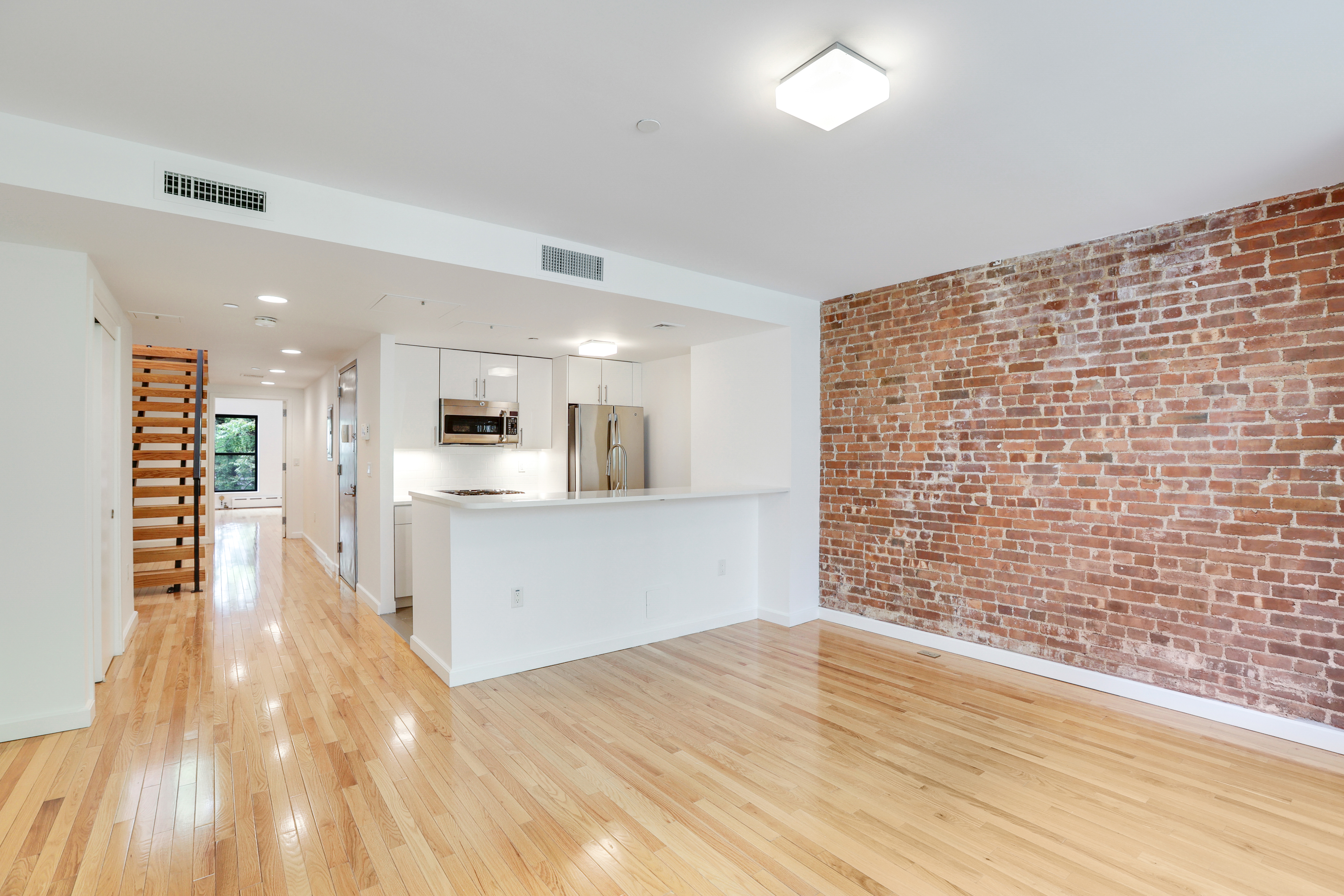 230 West 75th Street, Unit 4 Manhattan, NY 10023 - Photo 4 of 16 a view of kitchen with wooden floor