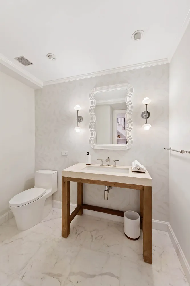 a view of a bathroom with a sink and mirror