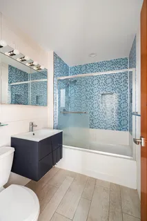 a bathroom with a bathtub and a sink