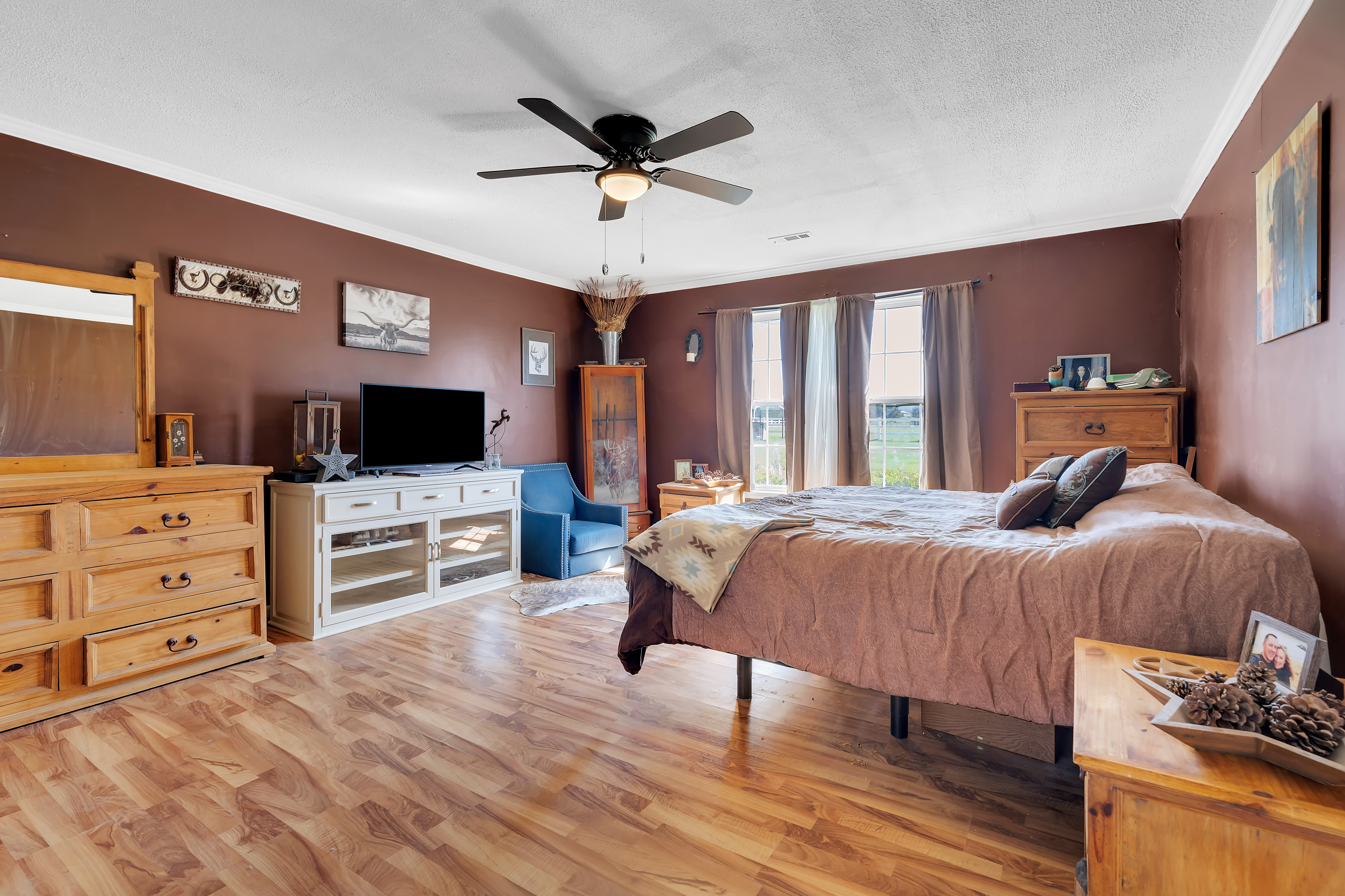 2073 Harpo Road Manchester, TN 37355 - Photo 35 of 45 a spacious bedroom with a bed and a flat screen tv