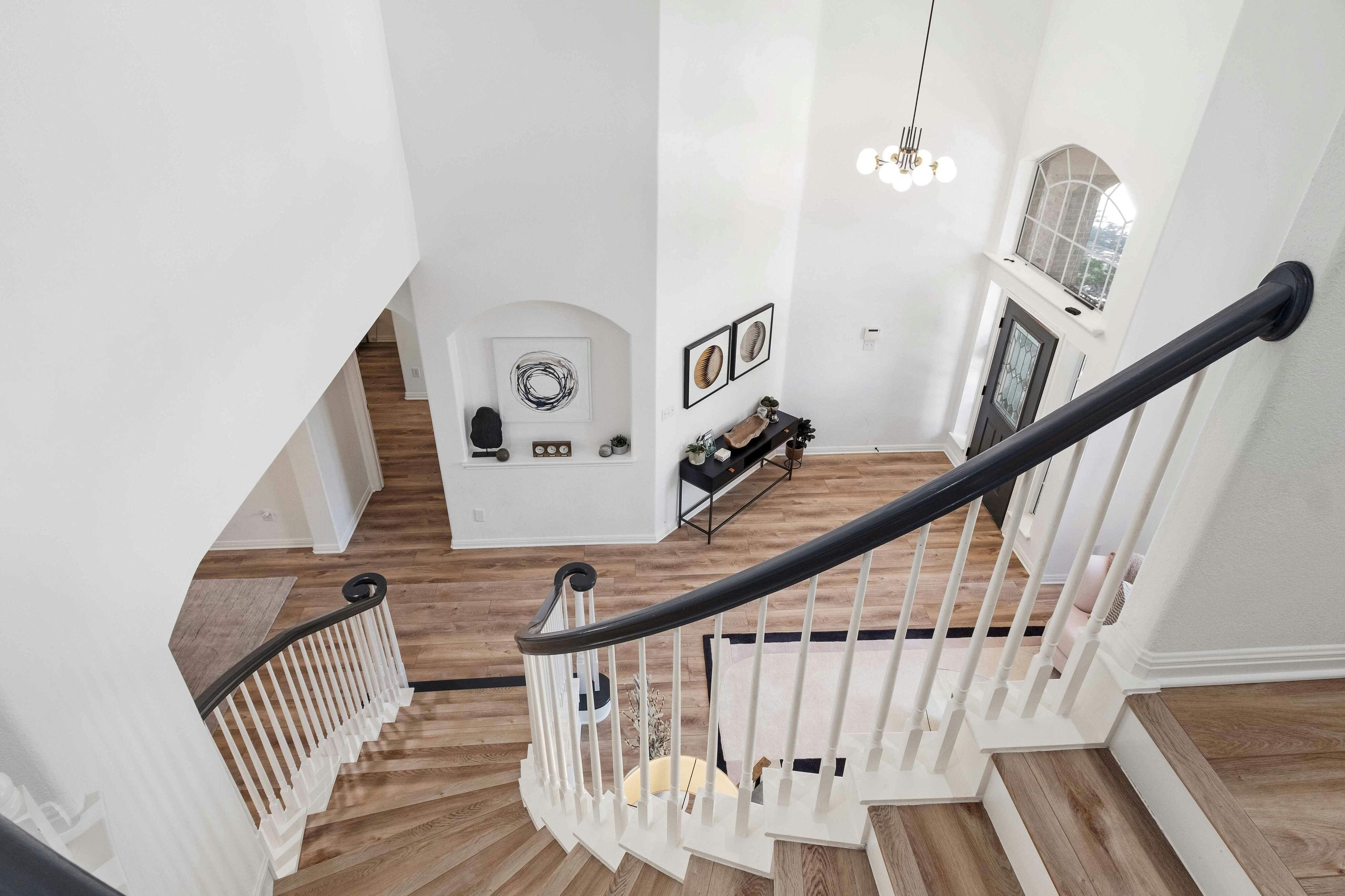 10608 Pointe View Drive Austin, TX 78738 - Photo 21 of 46 a view of staircase with railing and white walls