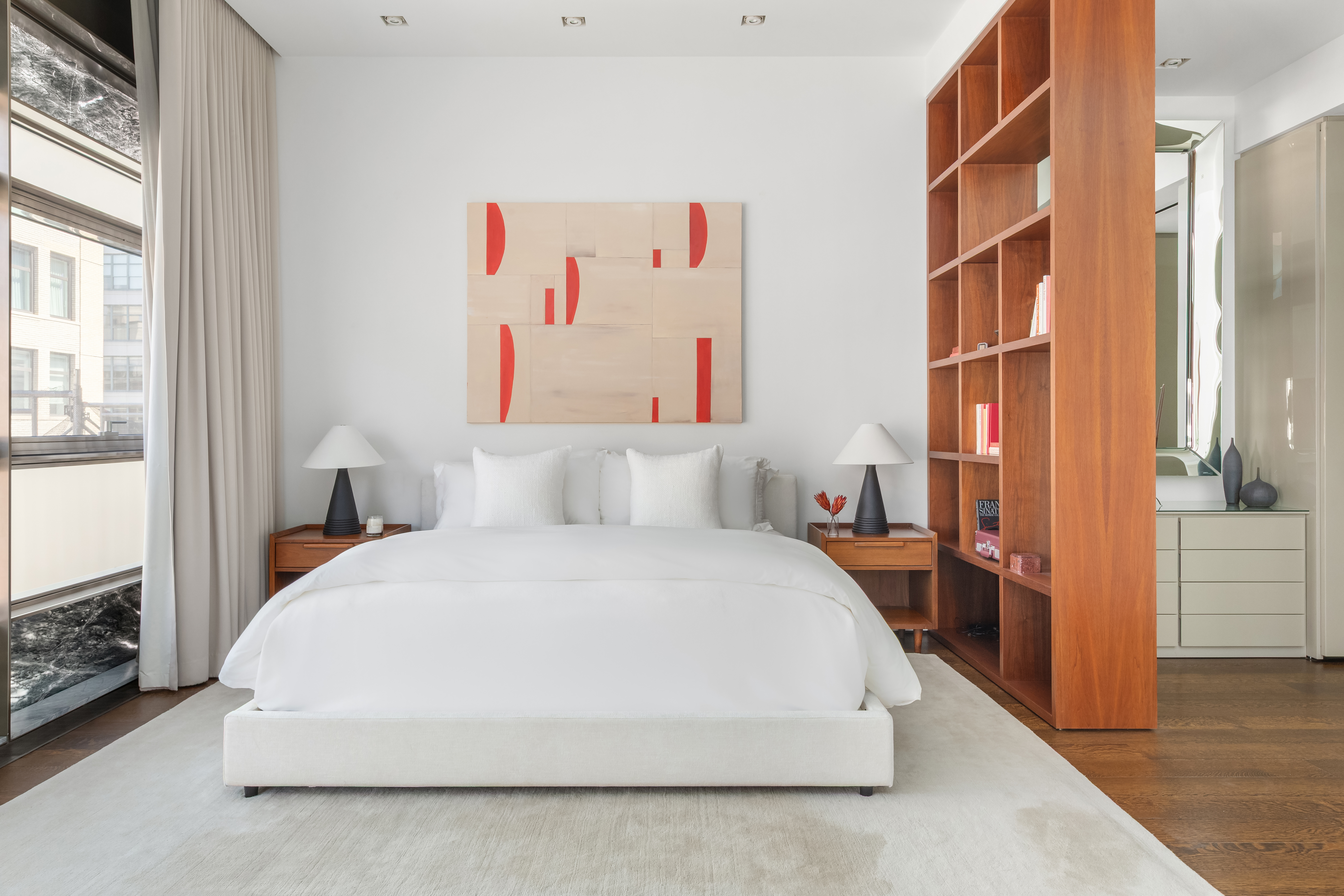 33 Vestry Street Manhattan, NY 10013 - Photo 7 of 16 a spacious bedroom with a bed and a cabinets