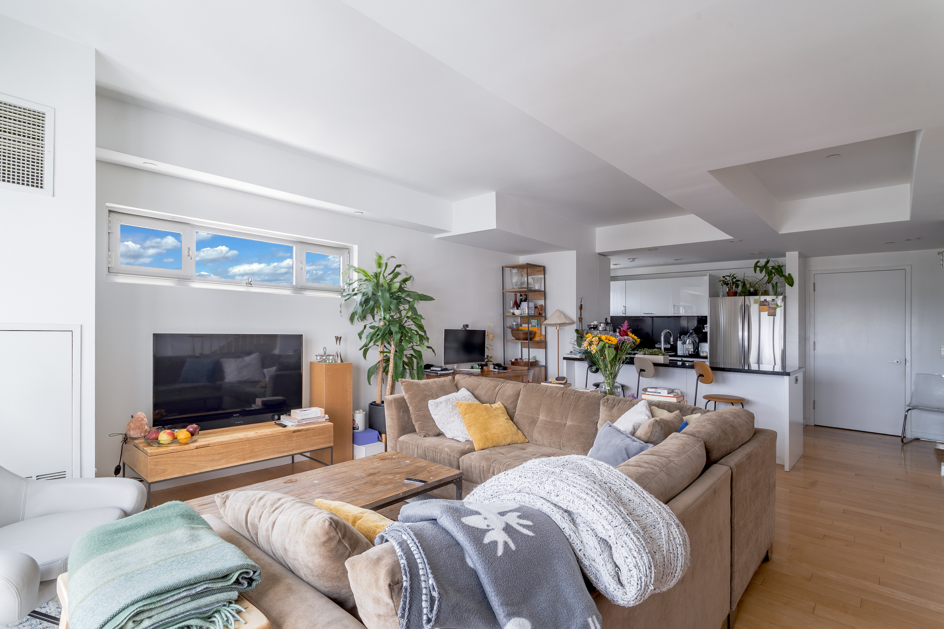 560 Carroll Street, Unit 11A Brooklyn, NY 11215 - Photo 5 of 15 a living room with furniture and a flat screen tv