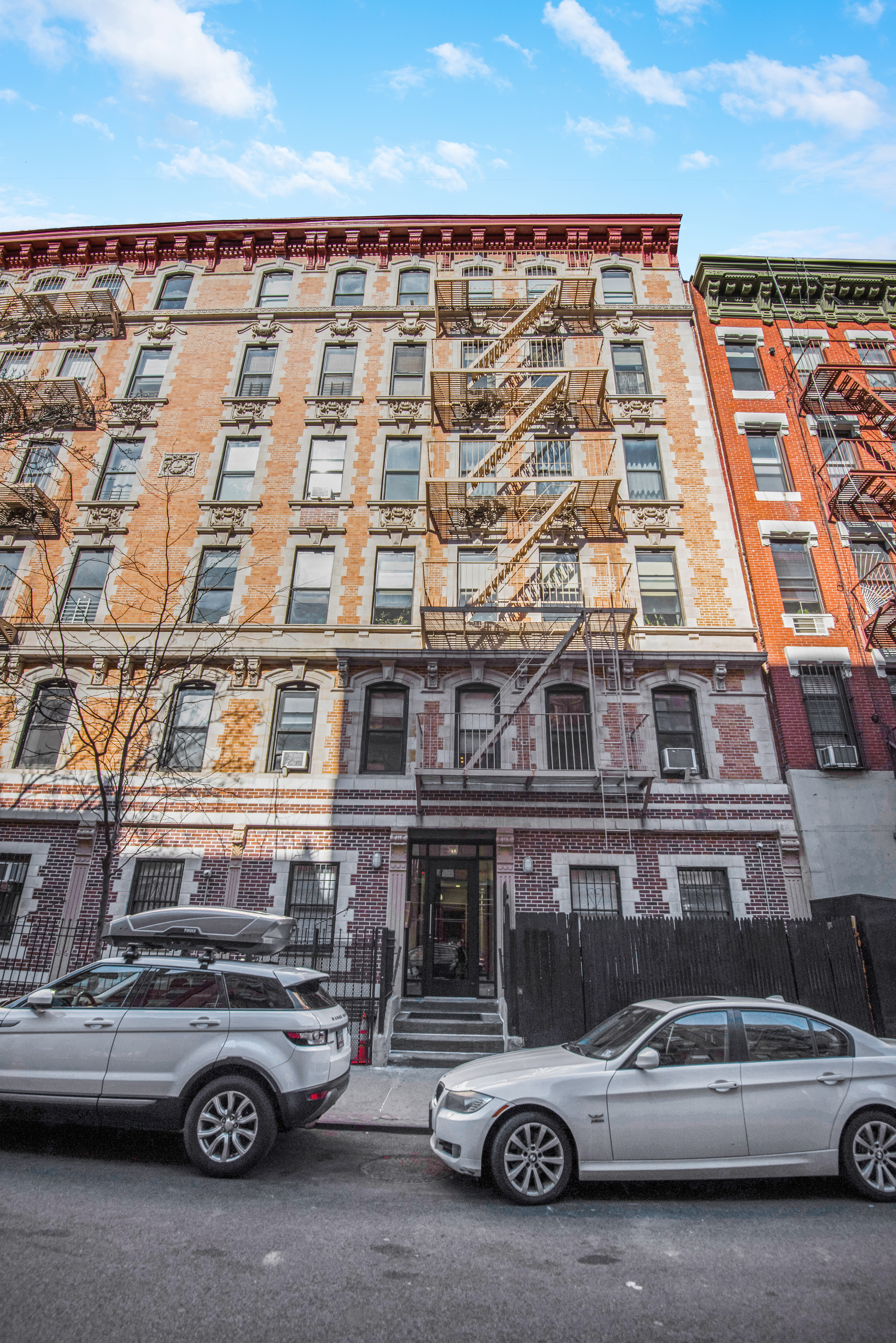 182 East 2nd Street, Unit 1E Manhattan, NY 10009 - Photo 13 of 14 a car parked in front of a building